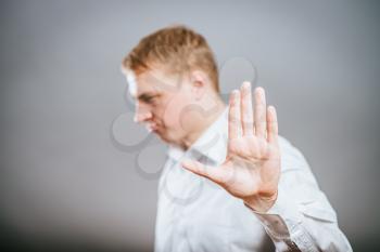 Businessman shows stop gesture