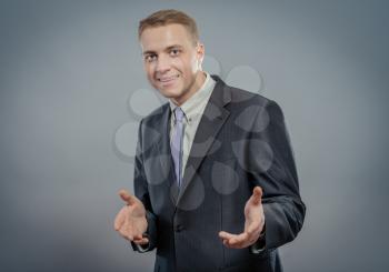 Business man presenting over a white background