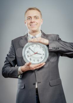 Clock in business man hands