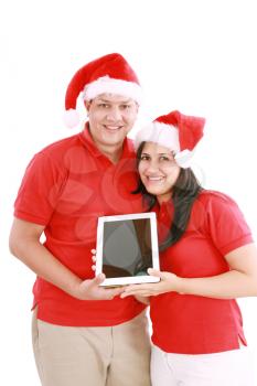 Couple enjoying their new touchpad on christmas 
