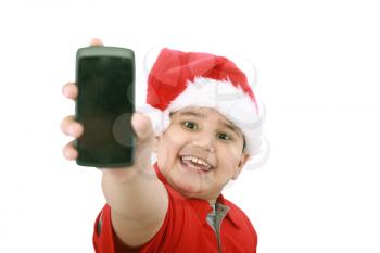 Little boy showing cell phone screen over white background. Boy on focus. 