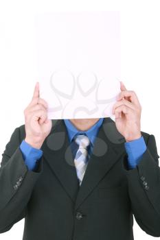 A businessman with a blank paper in his face isolated on white 