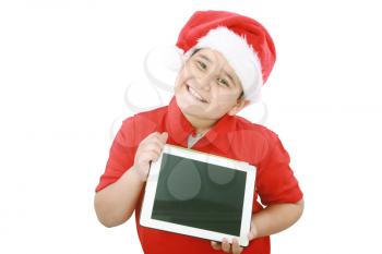 Adorable child with Santa hat offering a tablet isolated on white background 