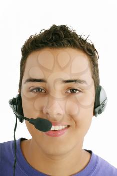 Smiling young man with telephone headset isolated on white background 
