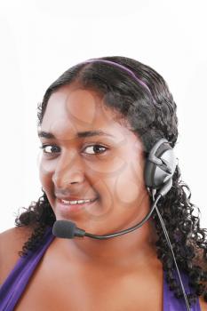 Smiling black customer service and support woman wearing headset 
