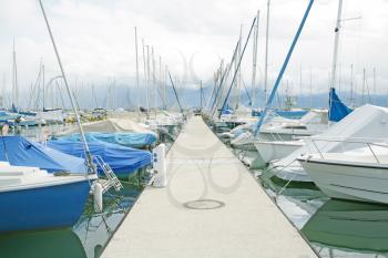 yachts and boats in the harbor in Ouchy, Switzerland
