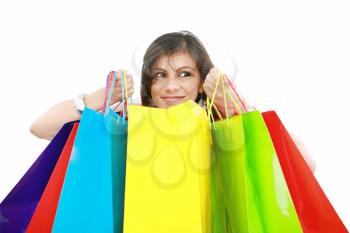 Beautiful shopping woman holding bags  isolated over white backgroung
