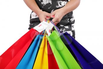 woman hands holding shopping bags isolated on white. Focus on hands