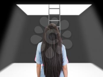 woman standing in a pit looking up to the ladder that leads out in to the light. 