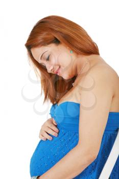 young pregnant woman holding her hands on her tummy 