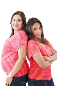 Beautiful hispanic pregnant woman with her daughter