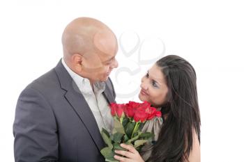 man giving a bouquet of red roses to his pretty girlfriend