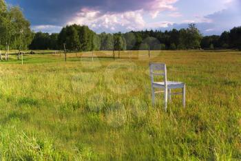 Royalty Free Photo of a Chair in a Field