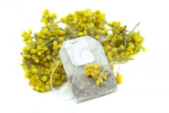 Royalty Free Photo of a Teabag and Flowers