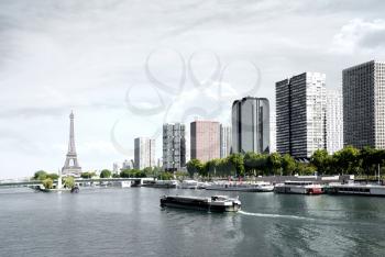 Paris, barge on the Seine and Eiffel tower, view from a bridge