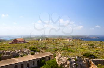 Peninsula of La Mola landscape with the powder magazine of the Fortress of Isabel II, Menorca, Spain.