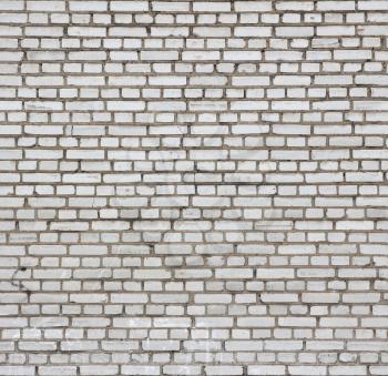 Aged white brick wall seamless texture.