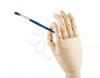 Royalty Free Photo of a Wooden Dummy Holding a Paintbrush