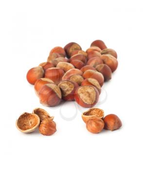 Royalty Free Photo of a Pile of Whole and Cracked Hazelnuts
