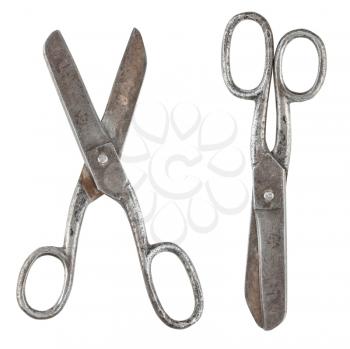 Rusty tailor scissors in closed and opened form isolated on white background
