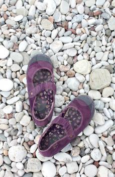 Royalty Free Photo of a Woman's Shoes on the Beach
