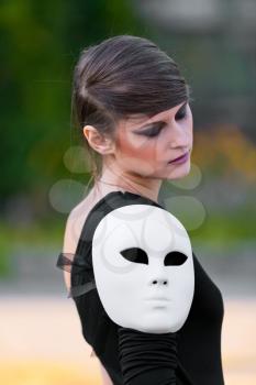 Royalty Free Photo of a Woman Posing With a Mask