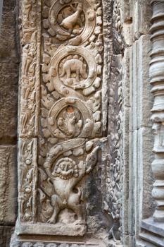 Royalty Free Photo of Dinosaur Carvings on the Wall in Ta Prohm Temple