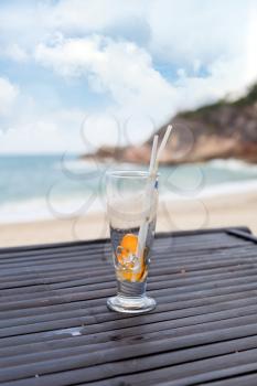 Royalty Free Photo of an Empty Drink on the Beach