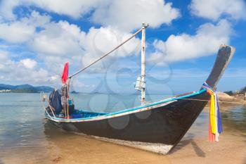 Royalty Free Photo of a Long Thai Boat on a Beach, Koh Samui, Thailand