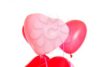 Pair of heart shaped balloons isolated on white background
