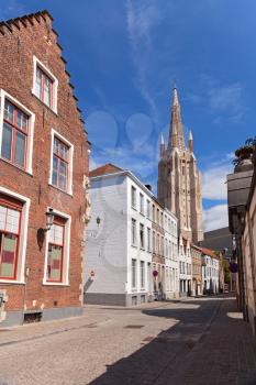 Tower and old houses in Bruges, Belgium
