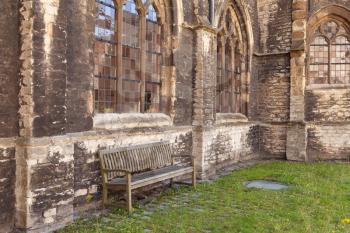 Medieval abbey yard with wooden bench in Gent, Belgium
