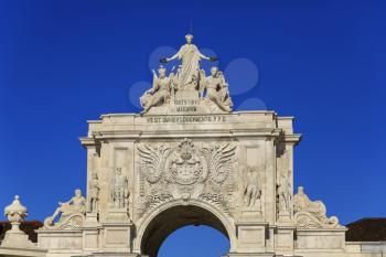 Arco da Rua Augusta with statues and blue sky, Lisbon, Portugal
