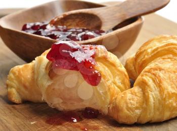 Royalty Free Photo of Jam on a Croissant