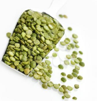 Royalty Free Photo of a Dry Green Peas In A Measuring Spoon