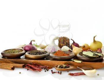 Royalty Free Photo of an Assortment of Spices on a Cutting Board