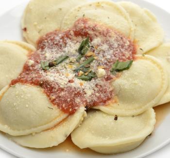 Royalty Free Photo of Ravioli Pasta With Tomato Sauce And Cheese