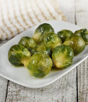 Roasted Brussels Sprouts  In A White Dish