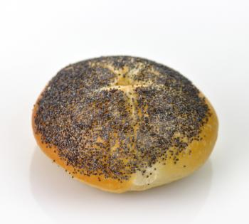 Kaiser roll with poppy seeds on white background 
