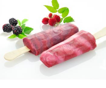 colorful  ice cream pops with fresh berries
