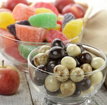 Chocolate Balls And Fruit Candies With Apples