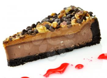 a slice of cheesecake with chocolate chips and nuts, close up