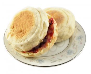 english muffins with jelly on white background