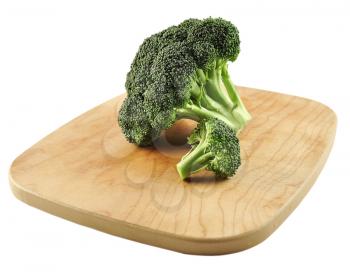 Broccoli Cabbage on a cutting board on white background