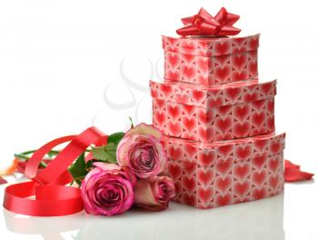 a stack of gift boxes and flowers on white background