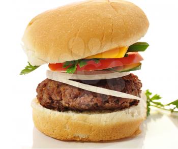 a cheeseburger on white background, close up