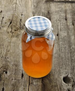 Jar Of Honey On Wooden Table
