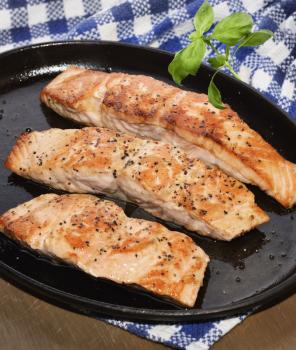 Fried Salmon Fillets In A Iron  Platter