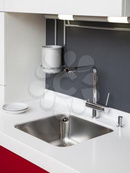 Modern kitchen sink with mixer tap 