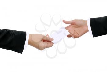 Two hands exchanging a business card